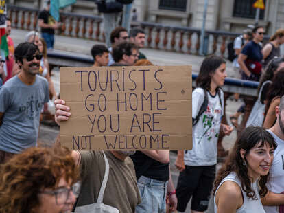 An anti-tourism placard is seen during the demonstration. More than 3,000 people demonstrated against the tourist overcrowding suffered by the city of Barcelona and in favor of tourism reduction policies. 