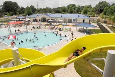 woman on yellow waterslide at seven springs water park