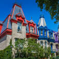 vibrantly colored townhouses on a tree-lined street in St. Louis Square