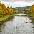 SUP in a river in fall