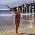 mayra santos female swimmer outstretched arms