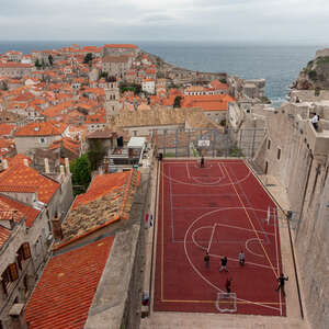 Old City Walls in Croatia overlooking a basketball court.